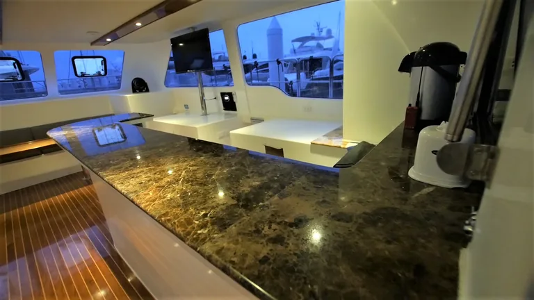 Fortuna 55 — saloon and galley Fortuna 55 — saloon and galley