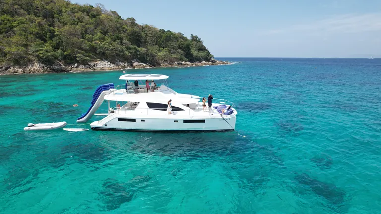 Leopard 51 Se La Vie — at anchor off the island with the water slide Leopard 51 Se La Vie — at anchor off the island with the water slide